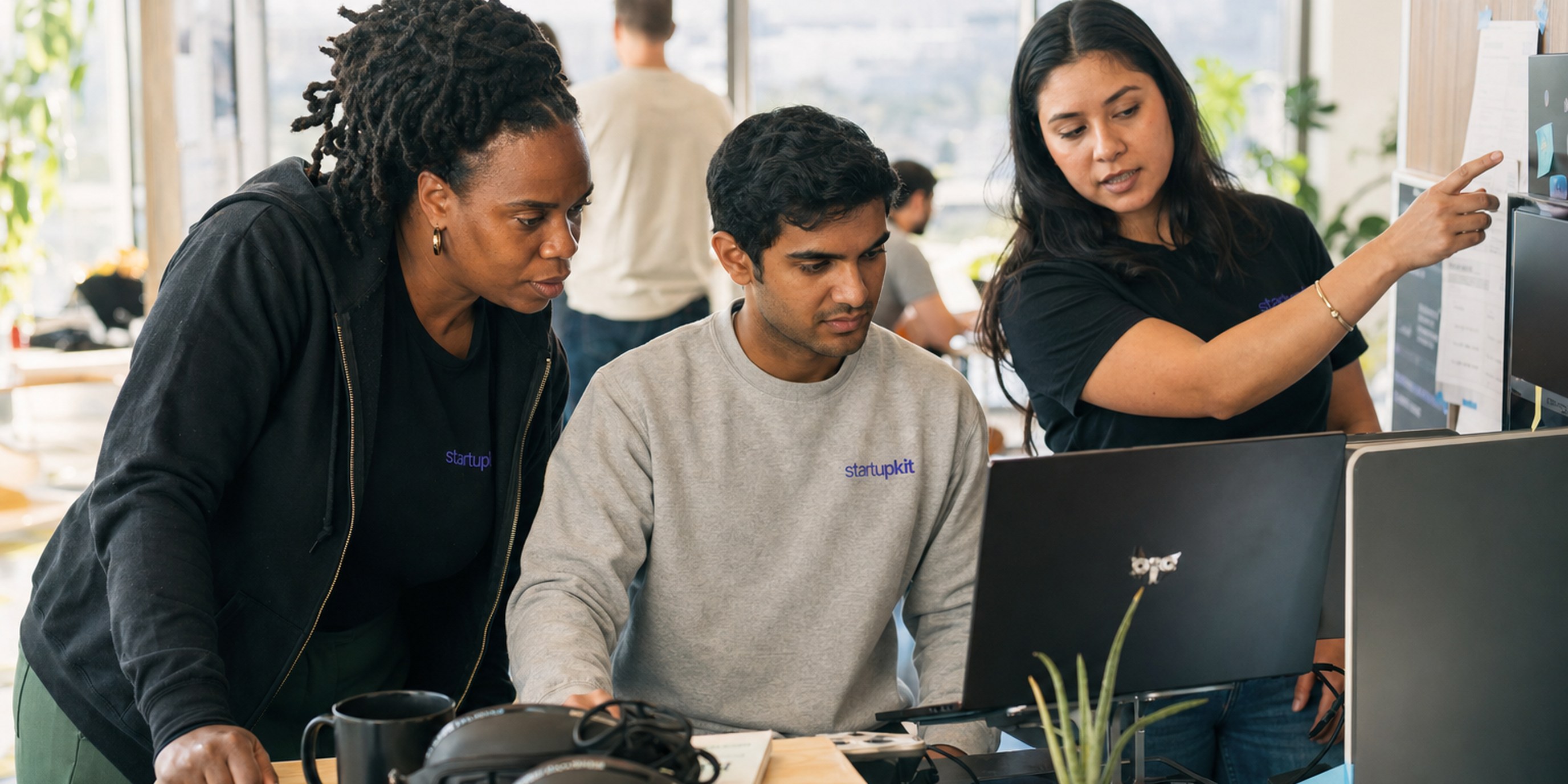 A security engineering hiring panel reviewing a candidate's calibrated CTF challenge writeup against a scoring rubric on a shared screen